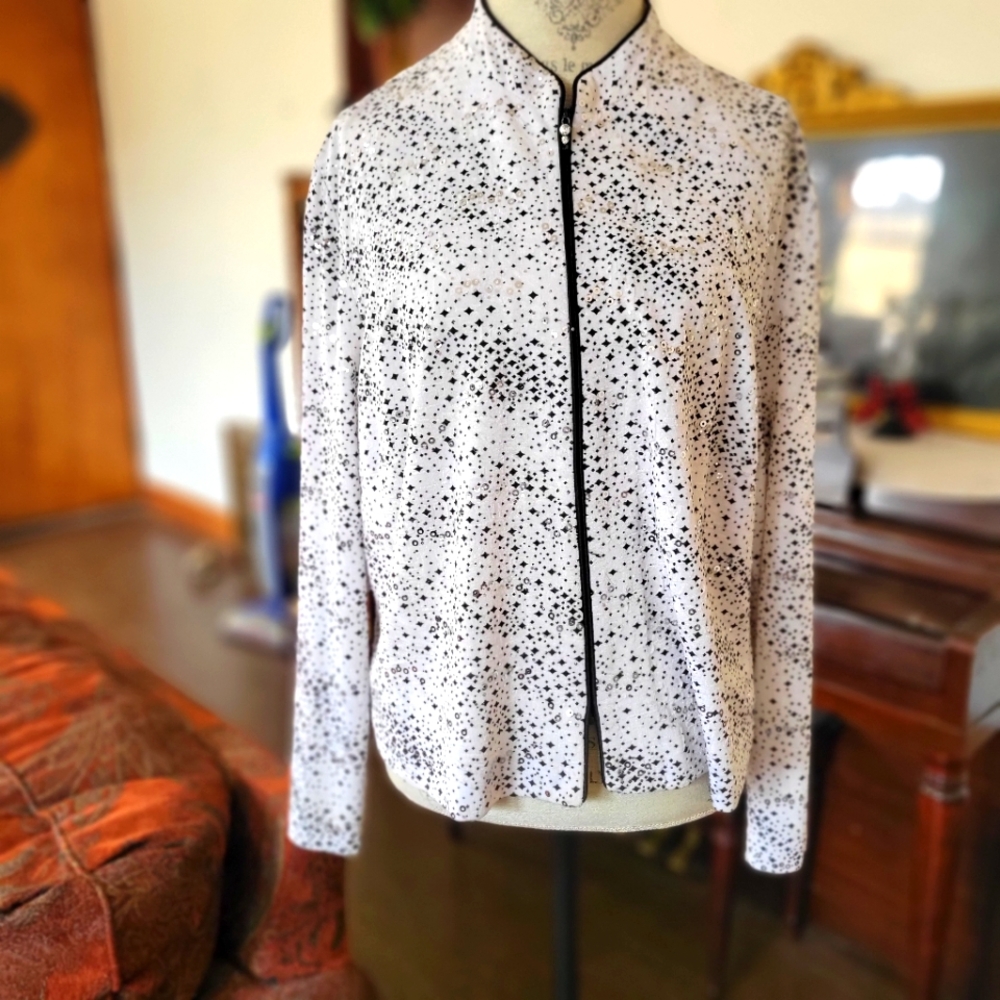 Stunning zip up jacket. Black, white and silver sparkles.